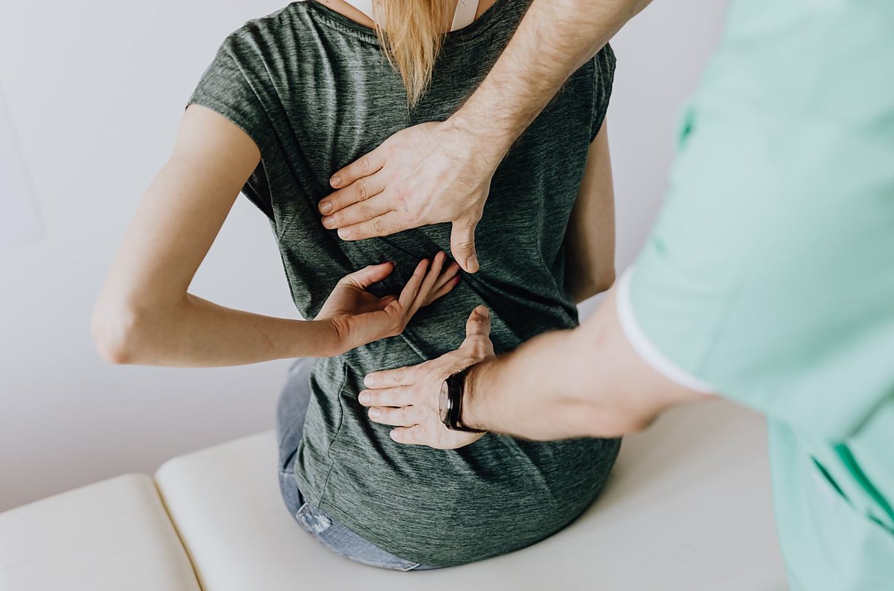 A gentle lower-back adjustment in the clinic